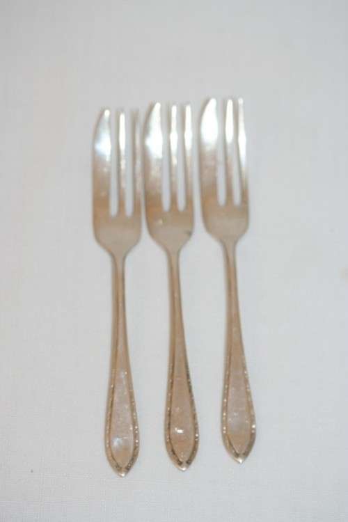 A fantastic set of three antique hallmarked Arthur Price & Co. sterling silver cake forks