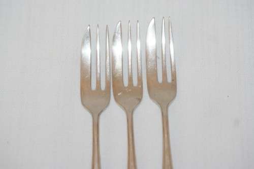A fantastic set of three antique hallmarked Arthur Price & Co. sterling silver cake forks