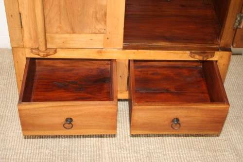 A magnificent Indonesian teak entertainment cabinet with traditional solid brass embellishments