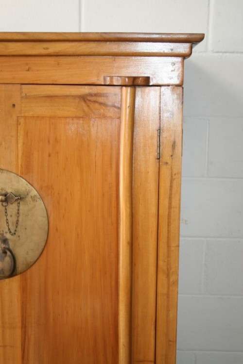 A magnificent Indonesian teak entertainment cabinet with traditional solid brass embellishments