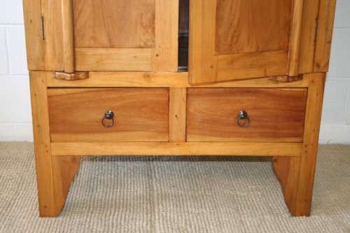 A magnificent Indonesian teak entertainment cabinet with traditional solid brass embellishments