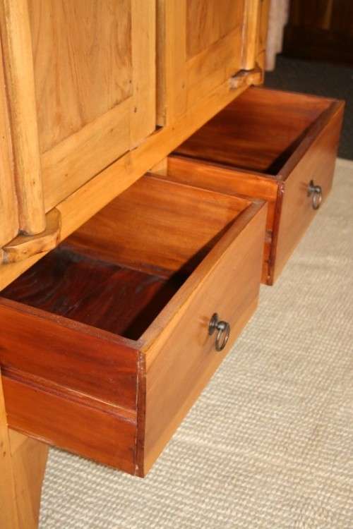 A magnificent Indonesian teak entertainment cabinet with traditional solid brass embellishments