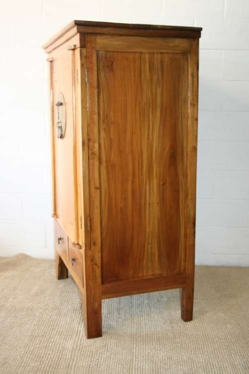 A magnificent Indonesian teak entertainment cabinet with traditional solid brass embellishments