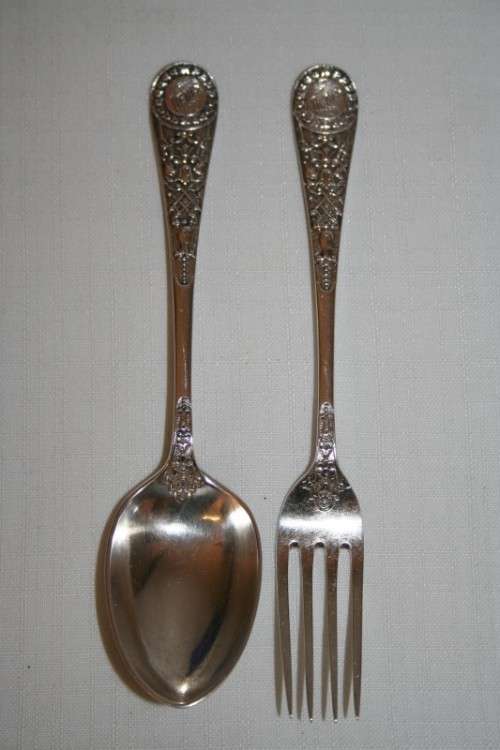 A magnificent antique hallmarked sterling silver "James Dixon & Sons" boxed fork and spoon set