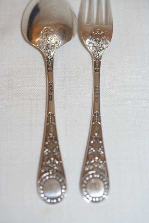 A magnificent antique hallmarked sterling silver "James Dixon & Sons" boxed fork and spoon set