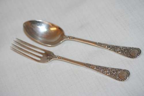 A magnificent antique hallmarked sterling silver "James Dixon & Sons" boxed fork and spoon set