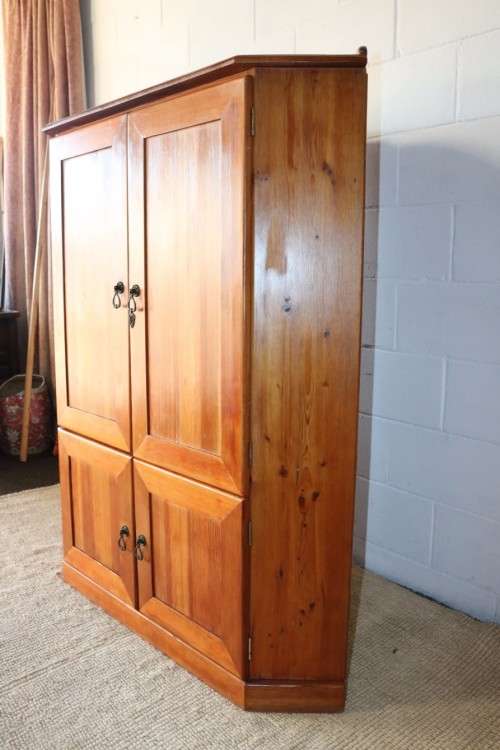 A solid Oregon pine corner display cabinet with a large cupboard. Stunning in any home!!