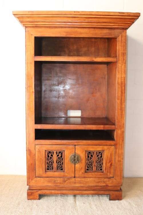 A spectacular Burmese teak entertainment cabinet with traditional solid brass embellishments