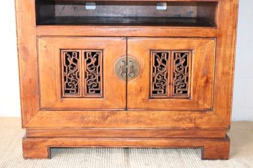A spectacular Burmese teak entertainment cabinet with traditional solid brass embellishments