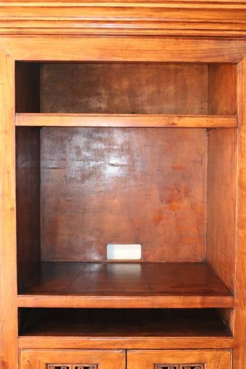 A spectacular Burmese teak entertainment cabinet with traditional solid brass embellishments