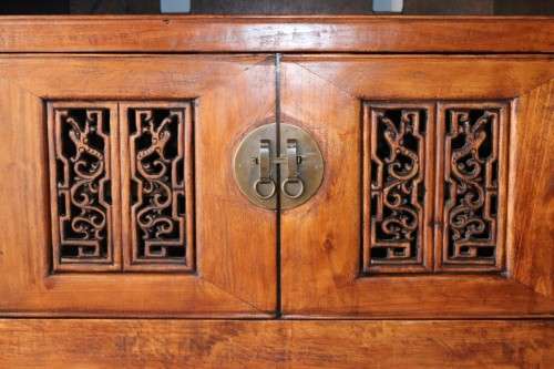 A spectacular Burmese teak entertainment cabinet with traditional solid brass embellishments