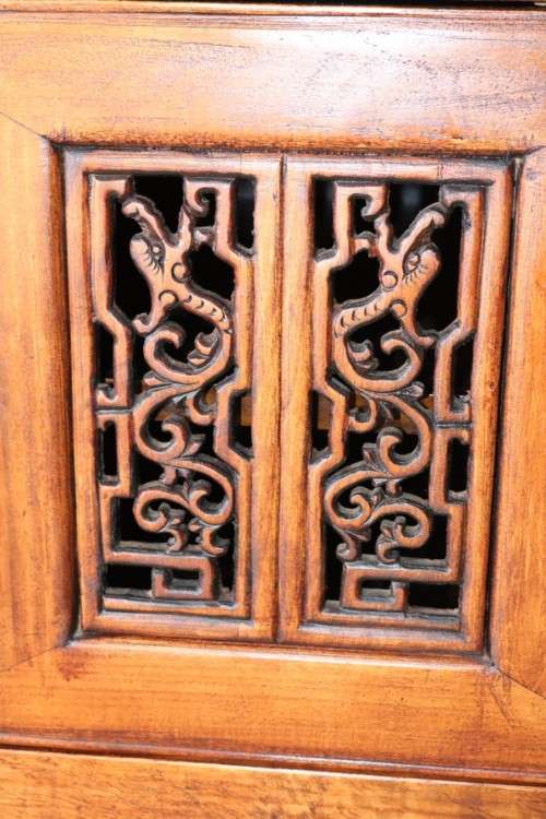 A spectacular Burmese teak entertainment cabinet with traditional solid brass embellishments