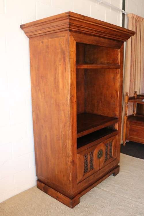 A spectacular Burmese teak entertainment cabinet with traditional solid brass embellishments