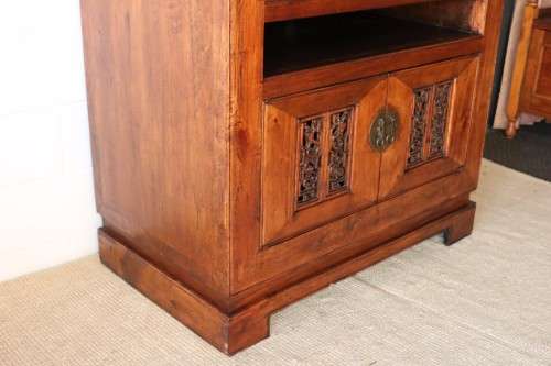 A spectacular Burmese teak entertainment cabinet with traditional solid brass embellishments