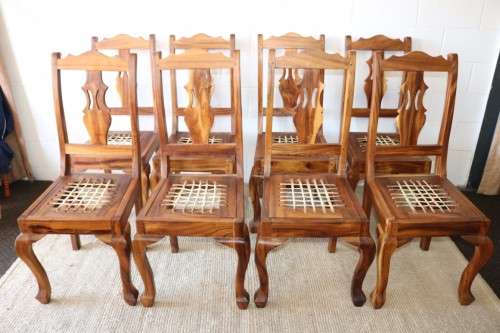 An absolutely magnificent African Blackwood 8-seater dining suite in exquisite condition - WOW