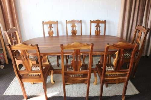 An absolutely magnificent African Blackwood 8-seater dining suite in exquisite condition - WOW