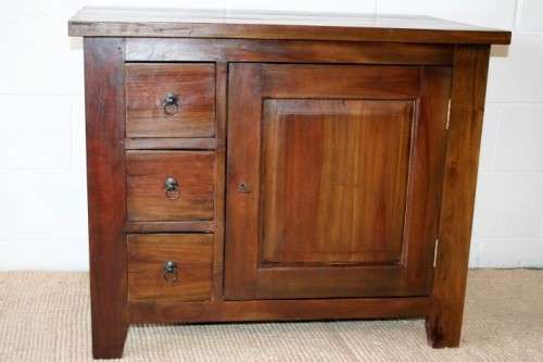 An exquisite solid oriental teak three-drawer cabinet w/ a good size cupboard in wonderful condition