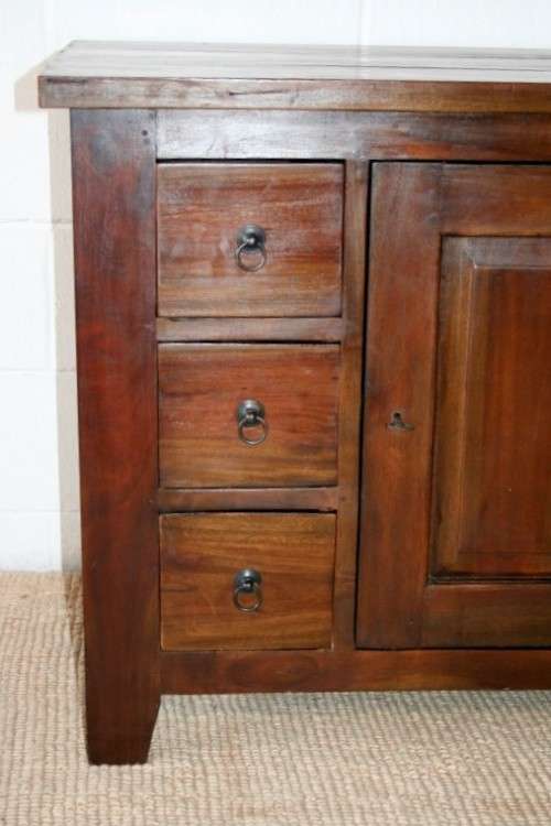 An exquisite solid oriental teak three-drawer cabinet w/ a good size cupboard in wonderful condition