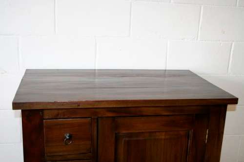 An exquisite solid oriental teak three-drawer cabinet w/ a good size cupboard in wonderful condition