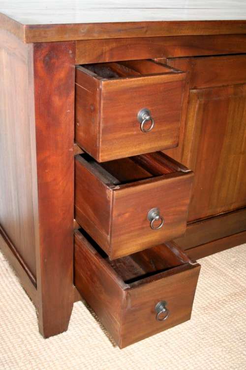 An exquisite solid oriental teak three-drawer cabinet w/ a good size cupboard in wonderful condition