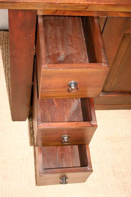 An exquisite solid oriental teak three-drawer cabinet w/ a good size cupboard in wonderful condition