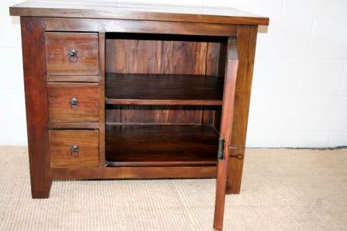 An exquisite solid oriental teak three-drawer cabinet w/ a good size cupboard in wonderful condition