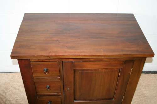 An exquisite solid oriental teak three-drawer cabinet w/ a good size cupboard in wonderful condition