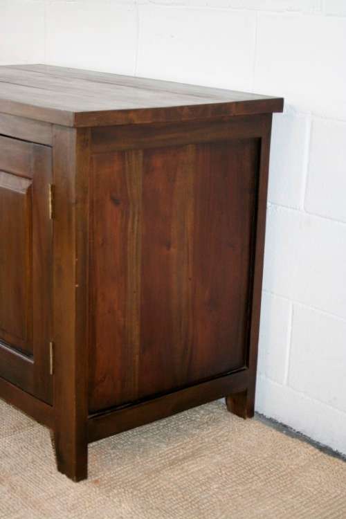 An exquisite solid oriental teak three-drawer cabinet w/ a good size cupboard in wonderful condition