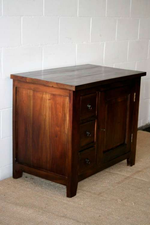 An exquisite solid oriental teak three-drawer cabinet w/ a good size cupboard in wonderful condition