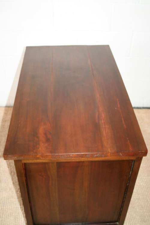 An exquisite solid oriental teak three-drawer cabinet w/ a good size cupboard in wonderful condition