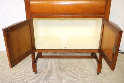 A remarkable Art Deco oak drinks cabinet with fall down counter and spacious cupboards