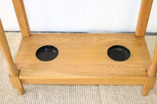A stunning tall oak hall stand with a beveled mirror, storage box and 2 hooks in great condition.