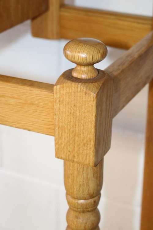 A stunning tall oak hall stand with a beveled mirror, storage box and 2 hooks in great condition.