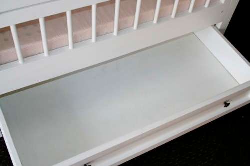 Price reduced!!! White babies crib bed/ cot w/ brass safety latches, fold-down side & large draw!