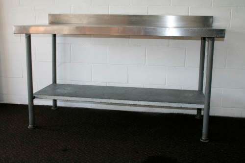 A fantastic (1.68m) stainless steel catering table with splash-back and galvanised storage shelf
