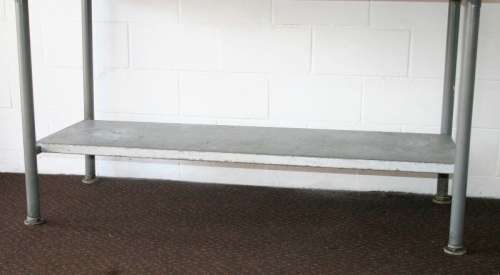 A fantastic (1.68m) stainless steel catering table with splash-back and galvanised storage shelf