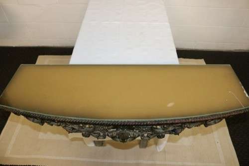 A fabulous antique wall mountable display shelf with amazing ormolu detailing and a glass top