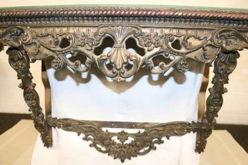 A fabulous antique wall mountable display shelf with amazing ormolu detailing and a glass top