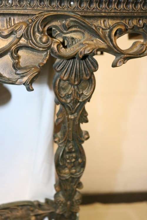 A fabulous antique wall mountable display shelf with amazing ormolu detailing and a glass top