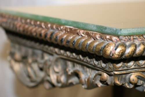 A fabulous antique wall mountable display shelf with amazing ormolu detailing and a glass top