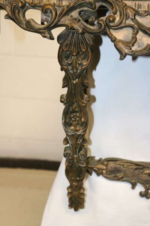 A fabulous antique wall mountable display shelf with amazing ormolu detailing and a glass top