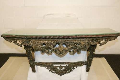 A fabulous antique wall mountable display shelf with amazing ormolu detailing and a glass top