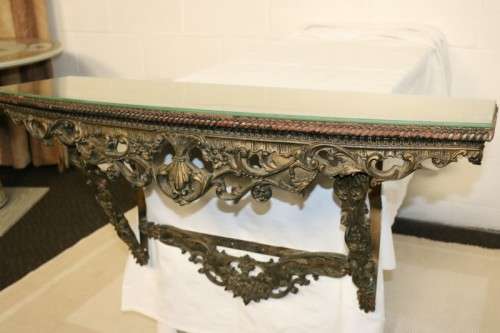 A fabulous antique wall mountable display shelf with amazing ormolu detailing and a glass top
