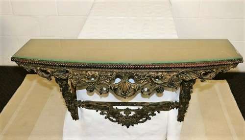A fabulous antique wall mountable display shelf with amazing ormolu detailing and a glass top