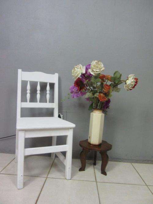 A solid wooden white dining in good condition - perfect for a beach house!