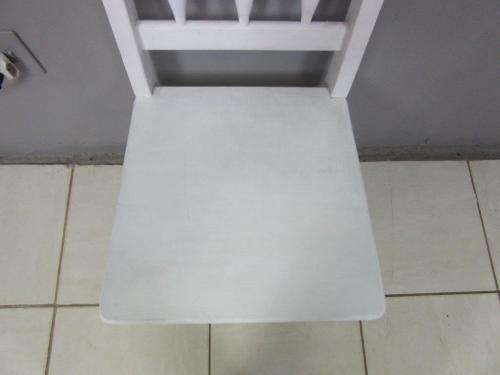 A solid wooden white dining in good condition - perfect for a beach house!