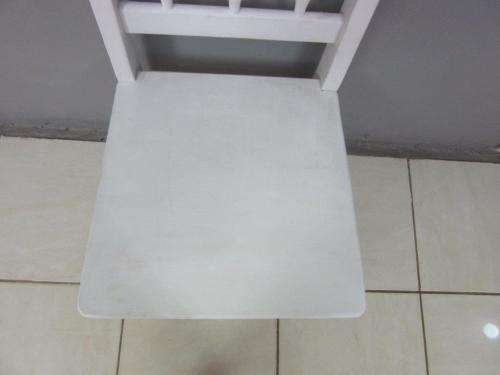 A solid wooden white dining in good condition - perfect for a beach house!