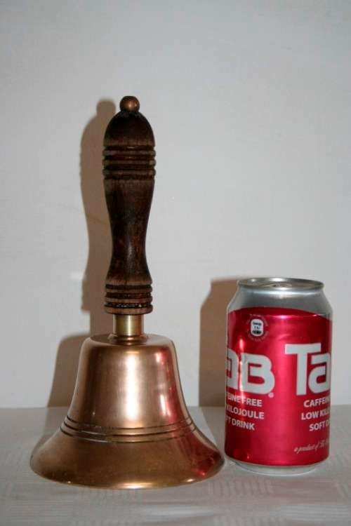 A gorgeous vintage (larger) solid brass hand bell/ school bell with a solid wooden handle