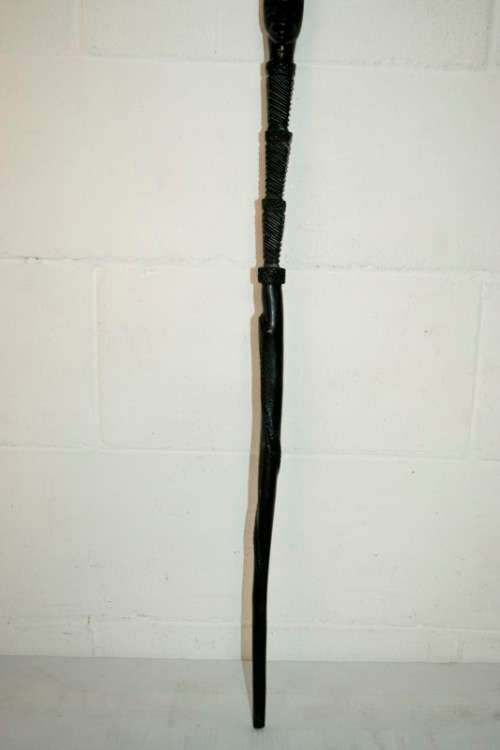 An incredibly detailed collectable hand carved African black wood walking stick - 91cm