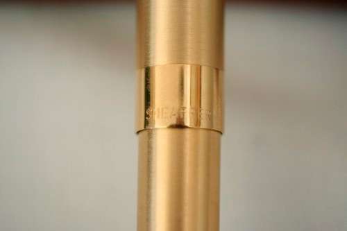 A superb boxed brushed 22ct gold plated engraved Sheaffer Legacy Heritage roller-ball pen